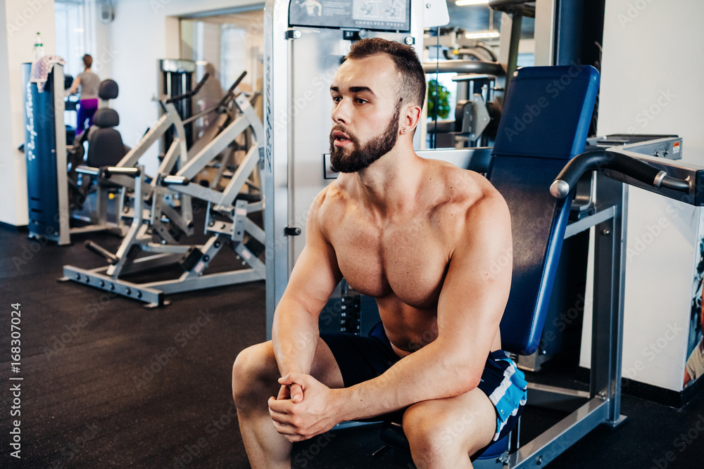 Fototapeta premium Muscular guy in the gym