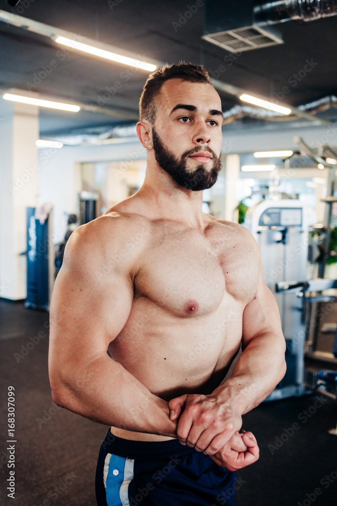 Muscular guy in the gym Muscular guy in the gym