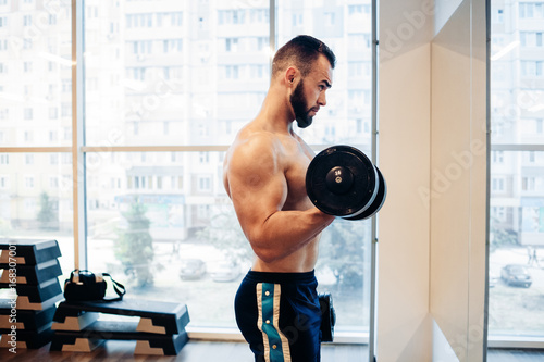 Muscular guy in the gym