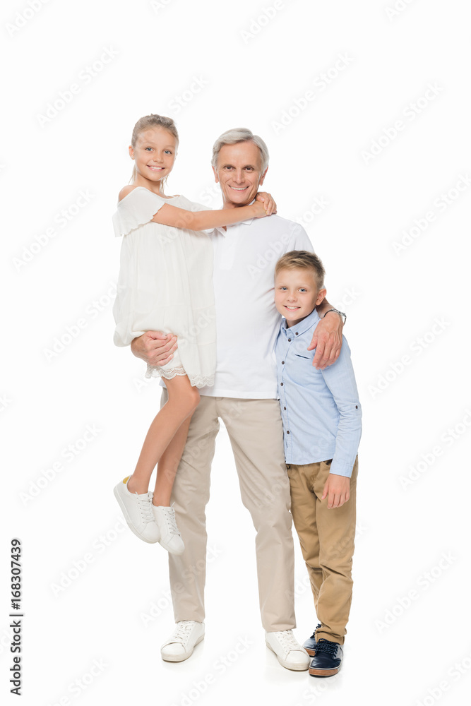 grandfather and grandchildren hugging together grandfather and grandchildren hugging together