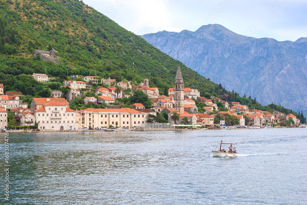 PERAST, MONTENEGRO - AUGUST 6, 2014: View of Perast city from sea side. Perast is beautiful town on coast of Montenegro and located on the Bay of Kotor