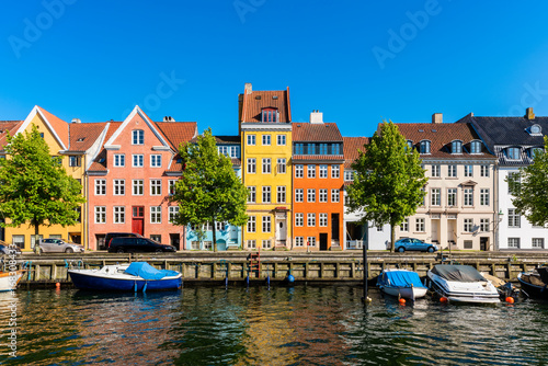 Canvas Print Colourful houses along canal in Downtown District of Copenhagen Denmark