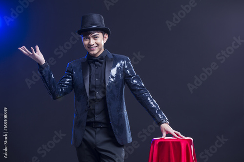 Young magician performing magic trick