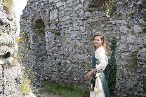 Nordic woman in the castle courtyard photo