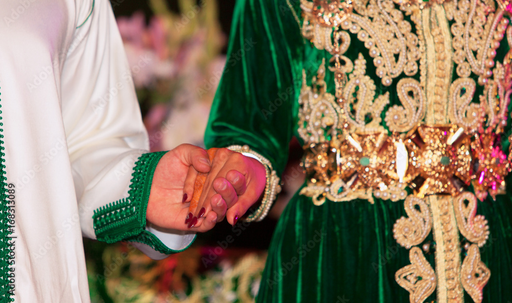 Close up of moroccon couple's hands at a wedding, concept of marriage, moroccan wedding