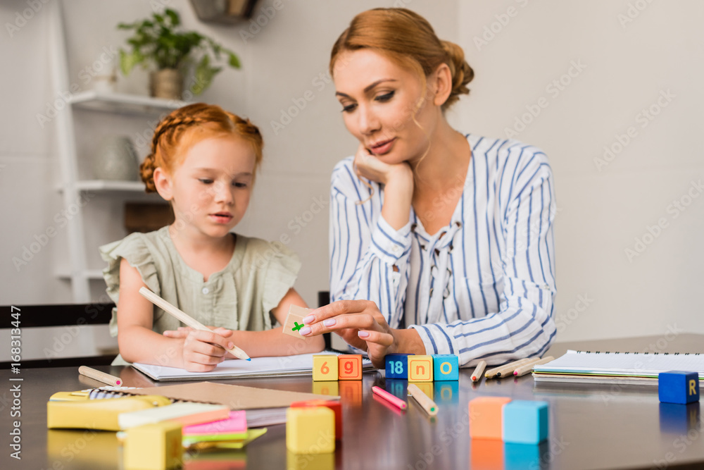 mother and daughter learning math with cubes mother and daughter learning math with cubes