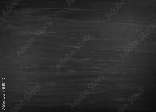 Blackboard / chalkboard texture. Empty blank black chalkboard with chalk traces.