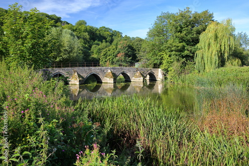 Packhorse Bridge on the river Avon at Barton Farm Country Park, Bradford on Avon, UK photo