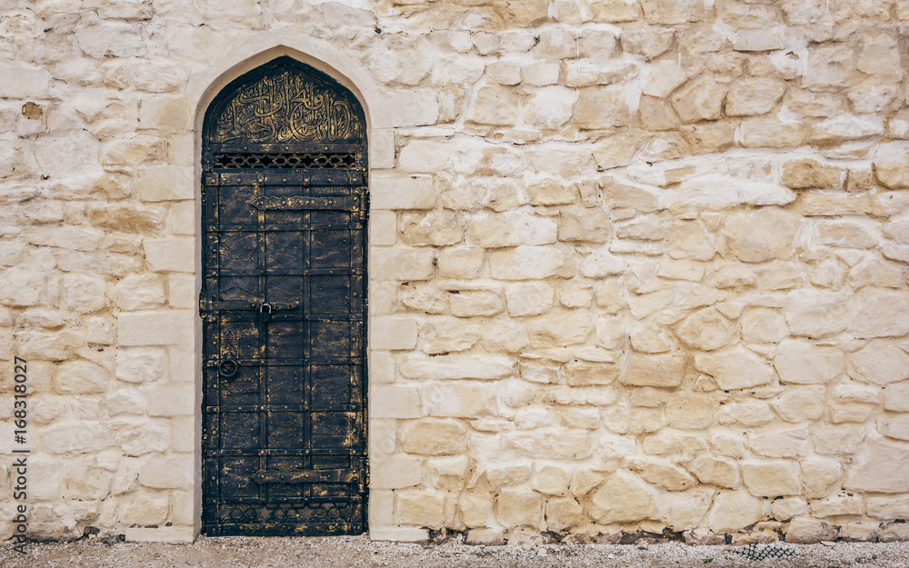 Stone Wall with Door and Oriental Engraving. Stone Wall with Door and Oriental Engraving.