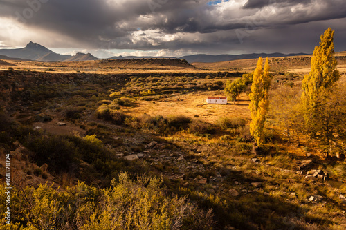 Canvas Print Clouds form over the landscape in the Karoo, South Africa.