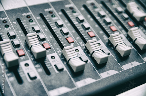 Selective focus professional audio mixing console panel.technology and entertainment concept
