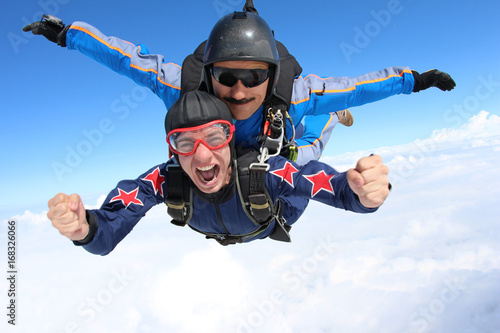 Photo Skydiving. Tandem jump. Happy Passenger.