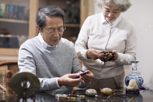Senior couple admiring antiques
