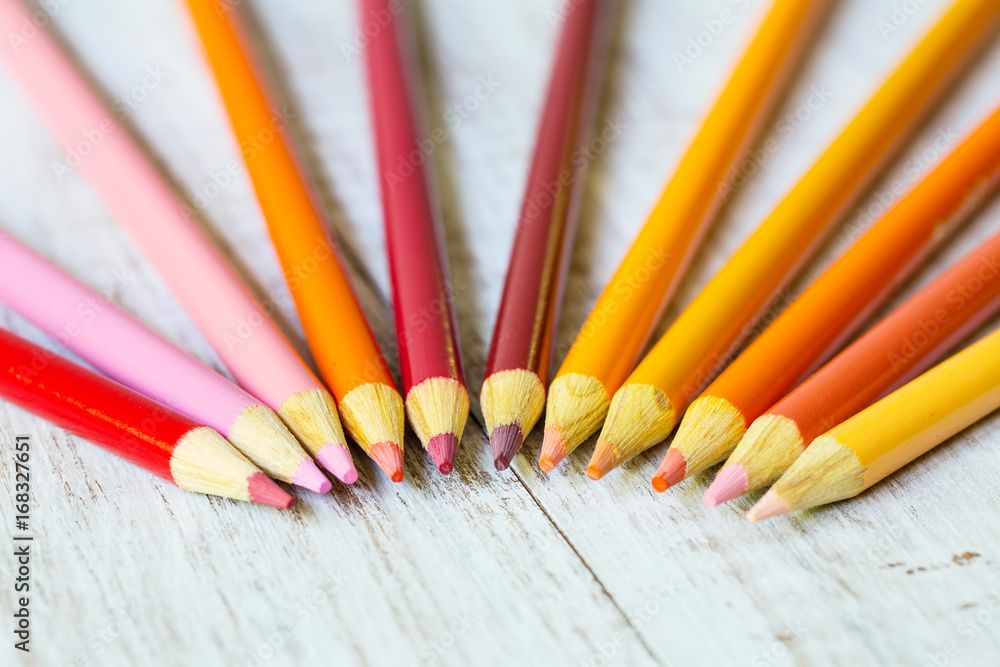 Naklejka premium Red Orange and Yellow Colored Pencils