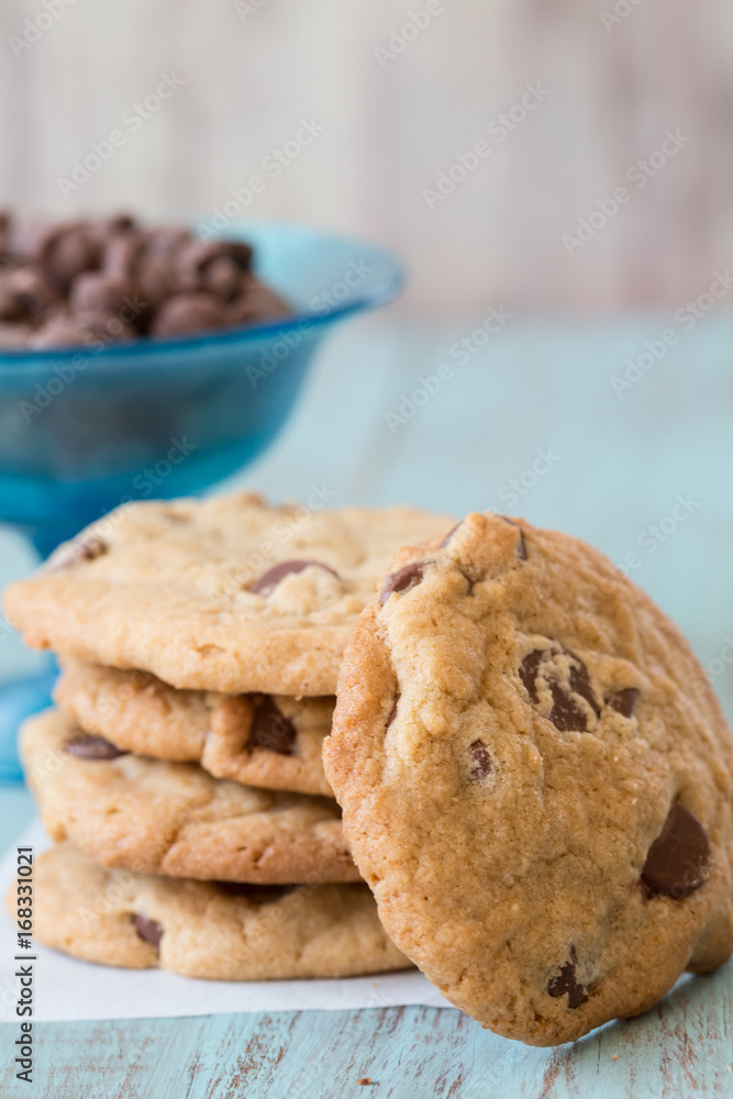 Chocolate Chip Cookies with a Bowl of Chips Behind Chocolate Chip Cookies with a Bowl of Chips Behind