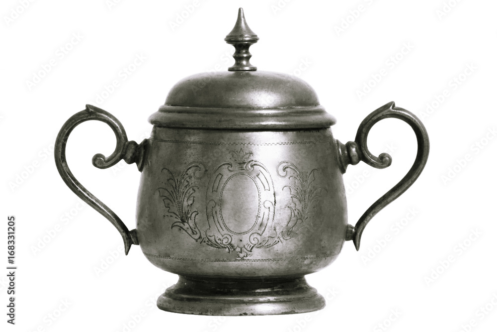 An old silver metal sugar bowl with a lid and ornament. Metal punctles with scratches and patina. An old silver metal sugar bowl with a lid and ornament. Metal punctles with scratches and patina.