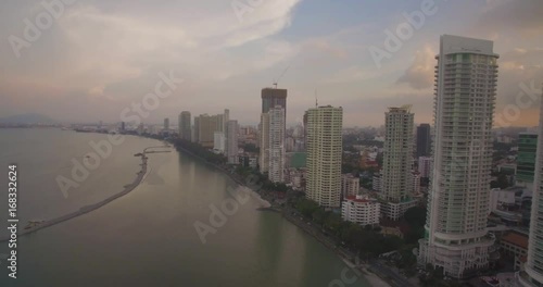 Gurney Drive And Georgetown in Penang, Malaysia at Sunset, Aerial Shot With Pan
 photo