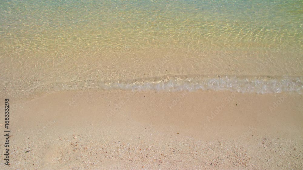 Tropical Clear Water Breaking Softly onto Pink Beach Sand Motion Background on a Sunny Day in an Exotic Setting of the Bahamas Islands Tropical Clear Water Breaking Softly onto Pink Beach Sand Motion Background on a Sunny Day in an Exotic Setting of the Bahamas Islands