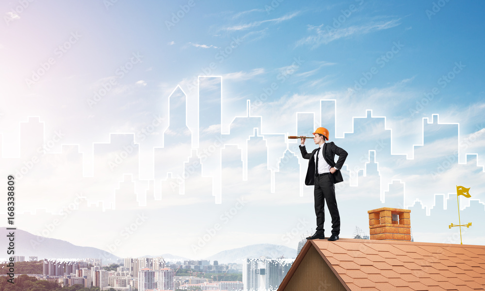 Engineer man standing on roof and looking in spyglass. Mixed media Engineer man standing on roof and looking in spyglass. Mixed media