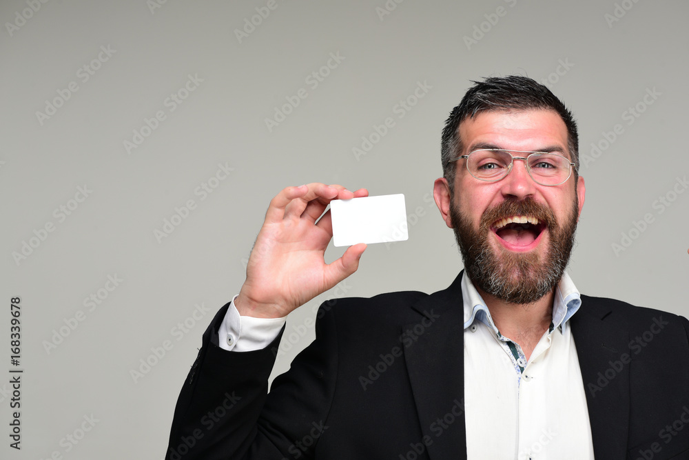 Businessman with happy face and glasses isolated on grey background