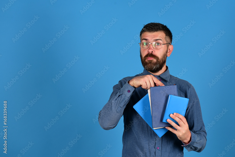 Man with beard and books. Knowledge and studying concept Man with beard and books. Knowledge and studying concept