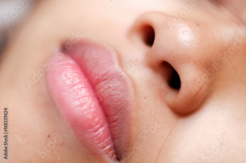 Young Asian woman closeup face sleeping during the day