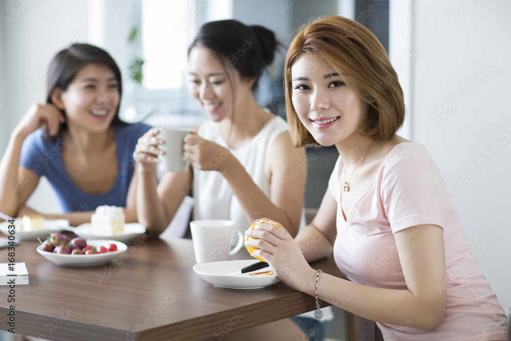 Best female friends having afternoon tea at home Best female friends having afternoon tea at home