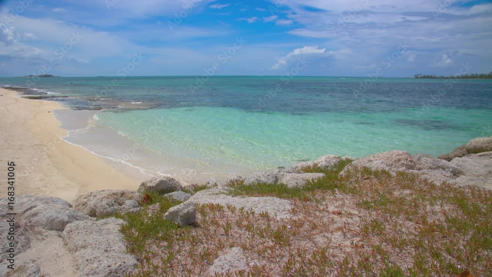 Exotic Bahamian Beach Scene in Nassau at Saunders Beach with Vibrant Colors of Blue Water Breaking onto Pink Sand on a Sunny Day in the Bahamas Capital Exotic Bahamian Beach Scene in Nassau at Saunders Beach with Vibrant Colors of Blue Water Breaking onto Pink Sand on a Sunny Day in the Bahamas Capital