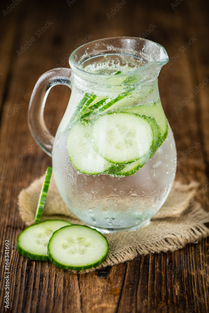 Fresh made Cucumber Water on a rustic background Fresh made Cucumber Water on a rustic background