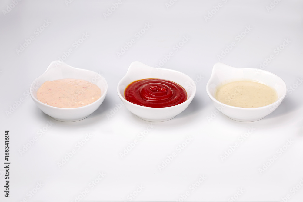 Close up photo of three different dipping dressing sauces Close up photo of three different dipping dressing sauces