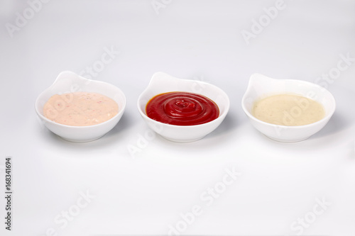 Close up photo of three different dipping dressing sauces