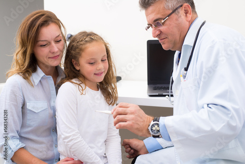 Doctor and young patient in office