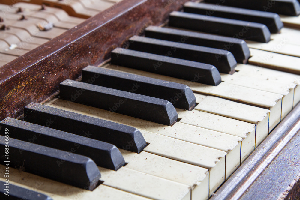 Keys from an old broken damaged piano