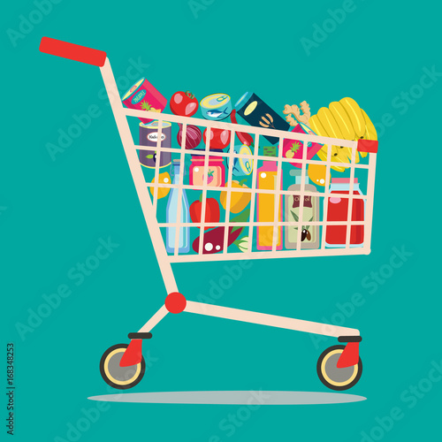 Shopping cart full of groceries products.