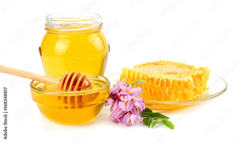 Honeycomb with honey dipper and honey isolated on white background Honeycomb with honey dipper and honey isolated on white background