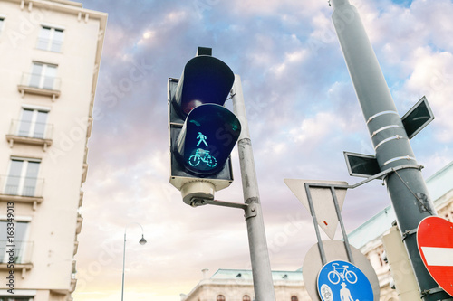 Green bicycle and pedestrian traffic lights in europe photo