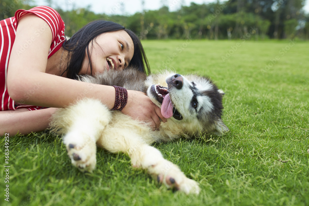 happy little asian girl with her dog outdoor happy little asian girl with her dog outdoor