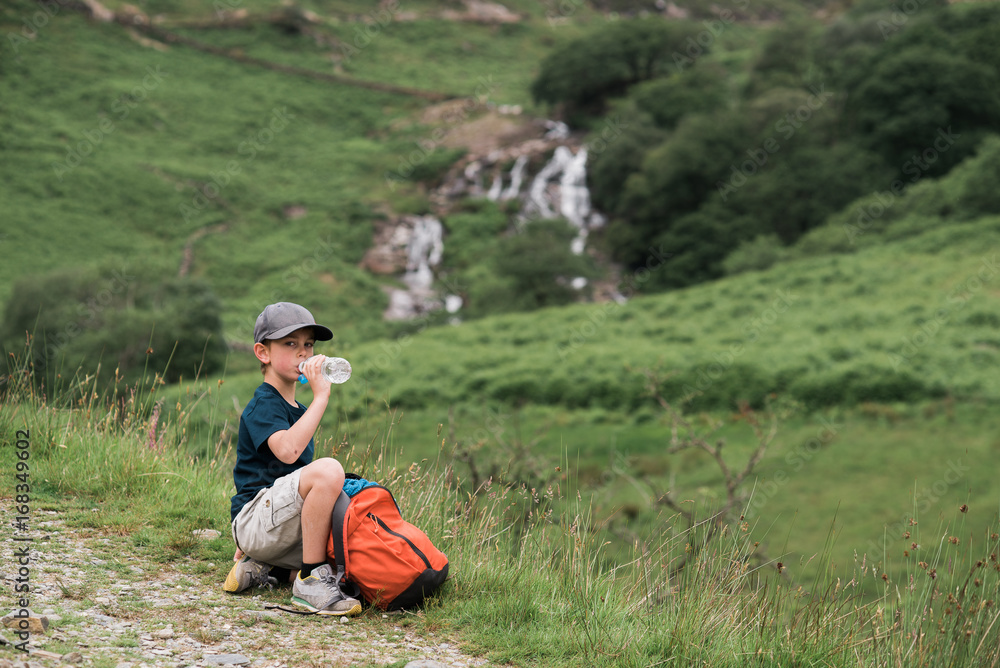little boy drinking eater on a hike little boy drinking eater on a hike