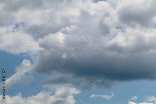 Blue grey altocumulus cloudscape with puffy clouds