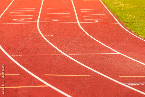 Red running track in stadium.