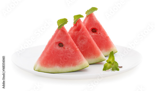 Slices of watermelon on plate isolated on white background.
