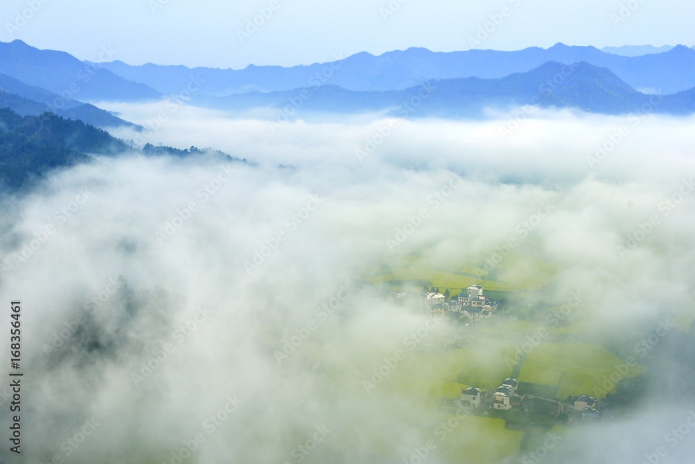village under the fog
