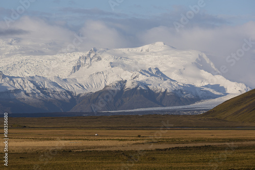 Landscape in island with glacier-covered mountains
