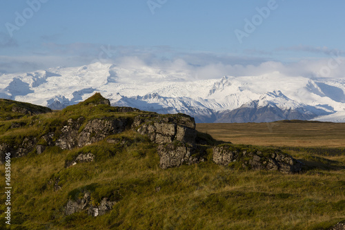 Landscape in island with glacier-covered mountains