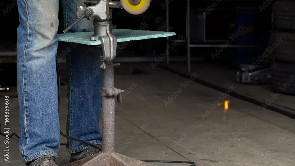 Male worker with angular grinding machine is cutting the metal Male worker with angular grinding machine is cutting the metal