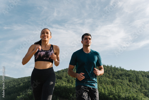 Young fitness enthusiasts enjoying getting in shape © djrandco