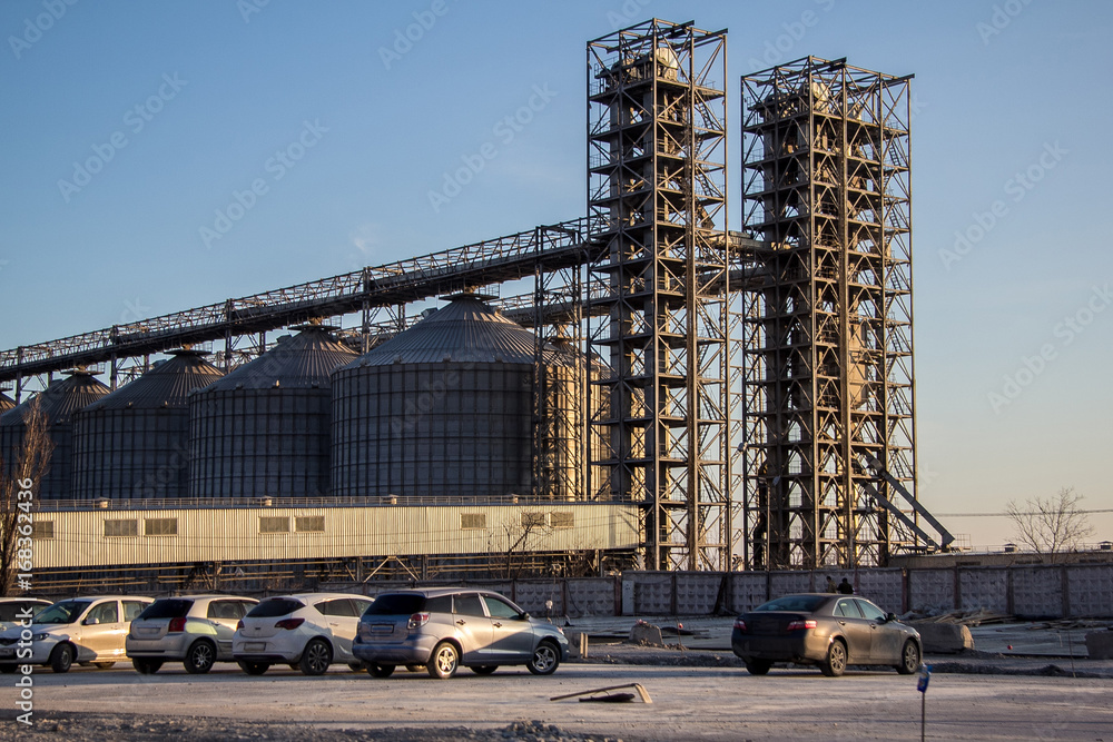 Naklejka premium Grain mill elevator and silos of compound feed plant