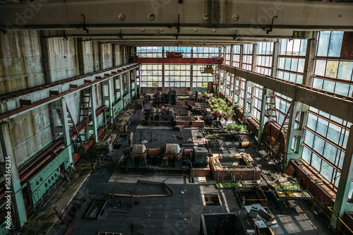 Large workshop in an abandoned factory, abandoned industrial concept photo