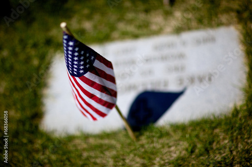 Stars and Stripes Flying Over a Veteran's Headstone