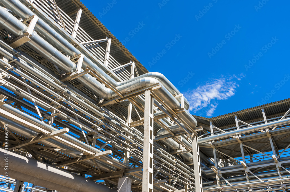 large and shiney, oil and gas pipes and pipelines inside chemical industry